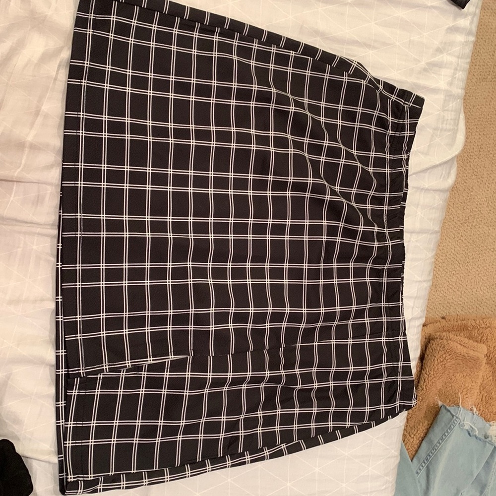 shown black plaid skirt